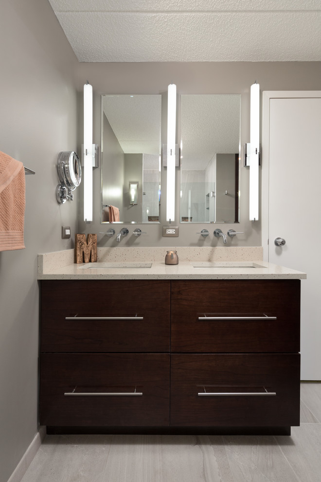 Mid-sized contemporary master bathroom in Chicago with flat-panel cabinets, dark wood cabinets, a curbless shower, a one-piece toilet, gray tile, stone tile, grey walls, ceramic floors, a drop-in sink and quartzite benchtops.