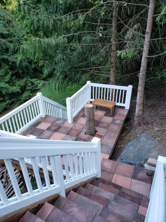 Example of a large mountain style backyard second story wood railing outdoor kitchen deck design in Seattle