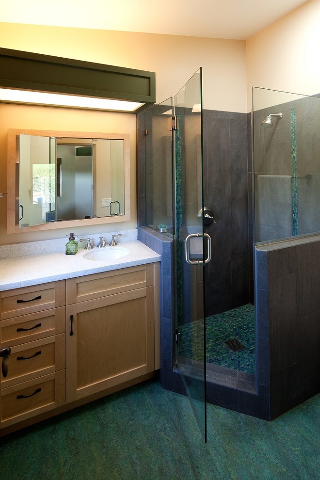 This is an example of a mid-sized country bathroom in San Luis Obispo with an undermount sink, shaker cabinets, light wood cabinets, engineered quartz benchtops, a freestanding tub, a shower/bathtub combo, a two-piece toilet, gray tile, porcelain tile and concrete floors.