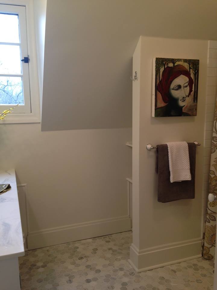 Inspiration for a small transitional kids bathroom in Cleveland with recessed-panel cabinets, white cabinets, a drop-in tub, an alcove shower, a two-piece toilet, white tile, porcelain tile, white walls, marble floors, an undermount sink and solid surface benchtops.