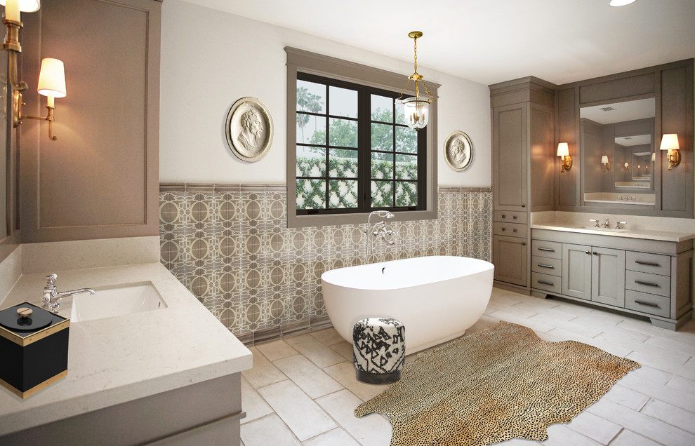 This is an example of a large transitional master bathroom in Phoenix with recessed-panel cabinets, grey cabinets, a freestanding tub, an alcove shower, gray tile, terra-cotta tile, white walls, terra-cotta floors, an undermount sink, engineered quartz benchtops, white floor, a hinged shower door, beige benchtops, an enclosed toilet, a double vanity and a built-in vanity.