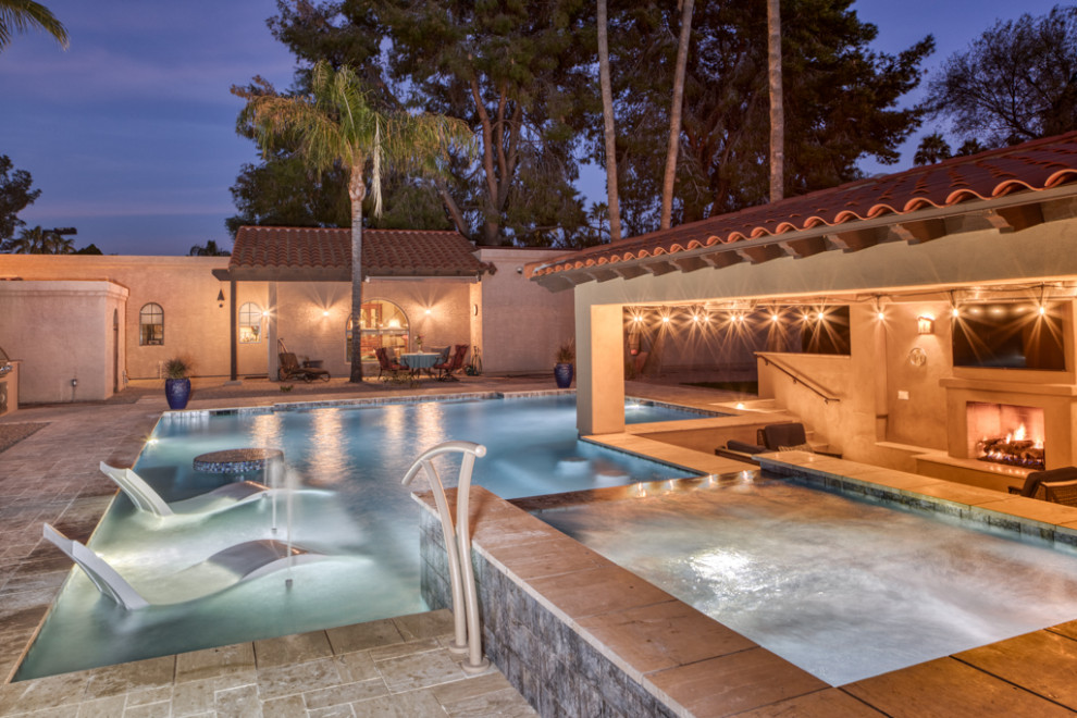 Inspiration for a large contemporary backyard custom-shaped natural pool in Phoenix with with a pool and concrete pavers.