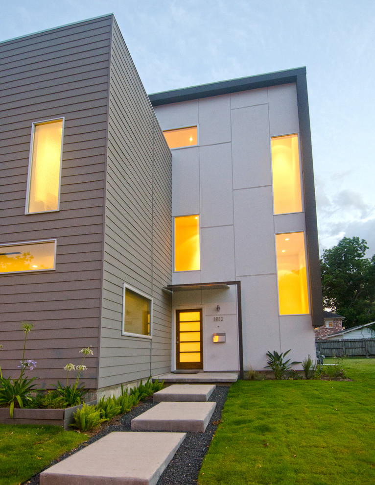 This is an example of a modern exterior in Houston with wood siding.