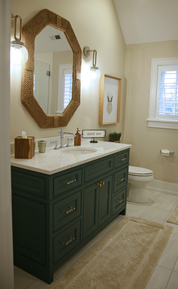 Inspiration for a mid-sized beach style bathroom in Milwaukee with flat-panel cabinets, turquoise cabinets, a freestanding tub, a corner shower, a one-piece toilet, white tile, subway tile, beige walls, porcelain floors, an undermount sink, engineered quartz benchtops, grey floor, a hinged shower door, white benchtops, a single vanity, vaulted and wallpaper.