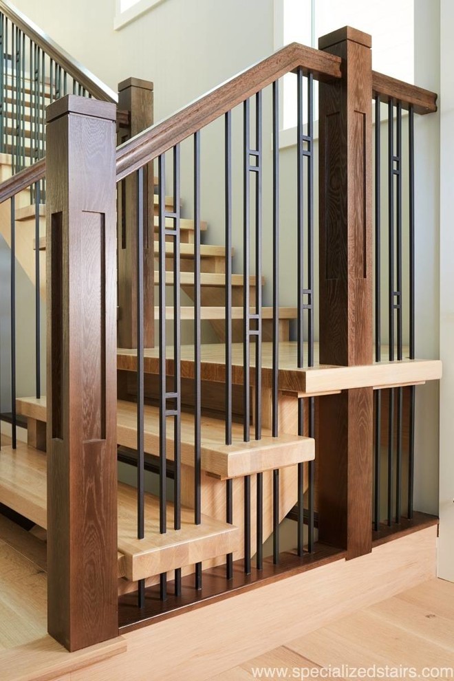 Arts and crafts wood straight staircase in Edmonton with open risers and mixed railing.