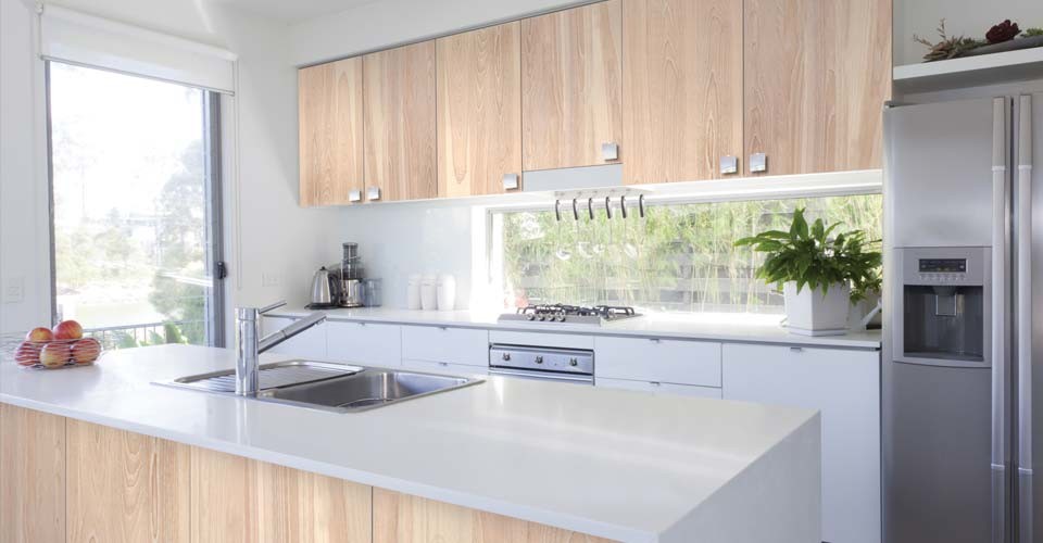 Inspiration for a mid-sized contemporary single-wall eat-in kitchen remodel in Montreal with flat-panel cabinets and an island