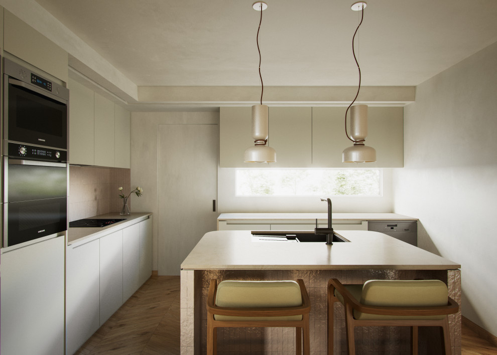 Design ideas for a modern grey and white l-shaped open plan kitchen in Valencia with a submerged sink, flat-panel cabinets, grey cabinets, limestone worktops, black splashback, metal splashback, stainless steel appliances, medium hardwood flooring, an island and beige worktops.