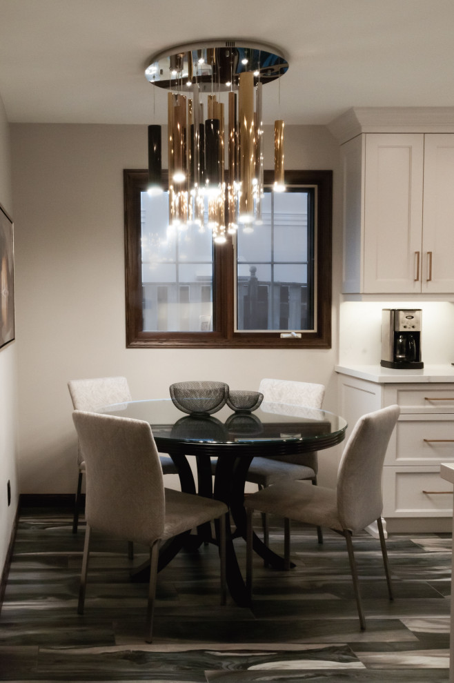 Small transitional u-shaped porcelain tile and gray floor enclosed kitchen photo in Toronto with an undermount sink, recessed-panel cabinets, white cabinets, quartz countertops, white backsplash, stone slab backsplash, black appliances and white countertops