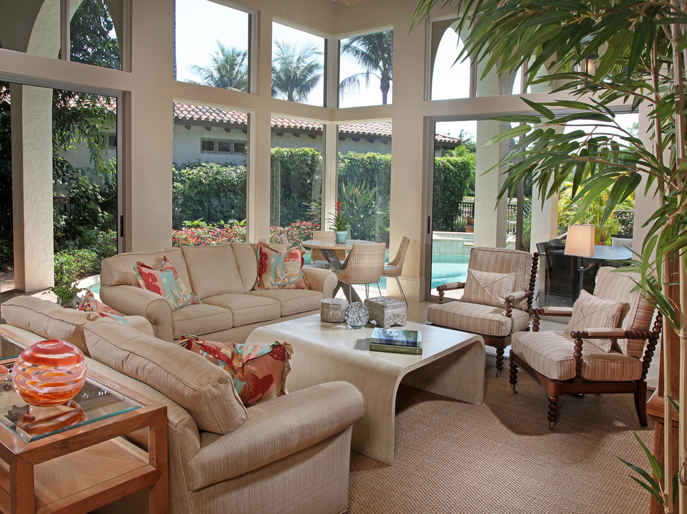 This is an example of a tropical family room in Miami with beige walls.