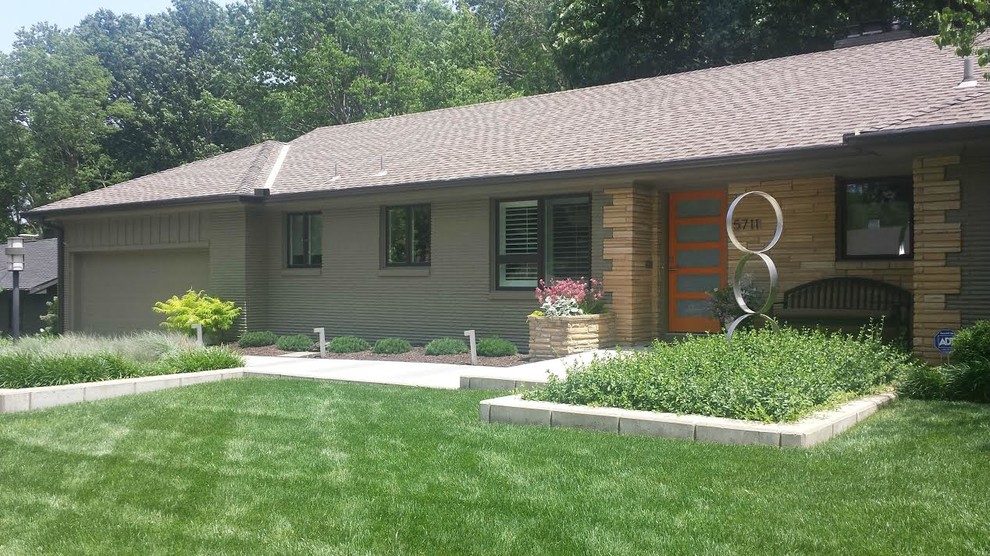 This is an example of a small contemporary one-storey brown house exterior in Kansas City with stone veneer, a gable roof and a shingle roof.
