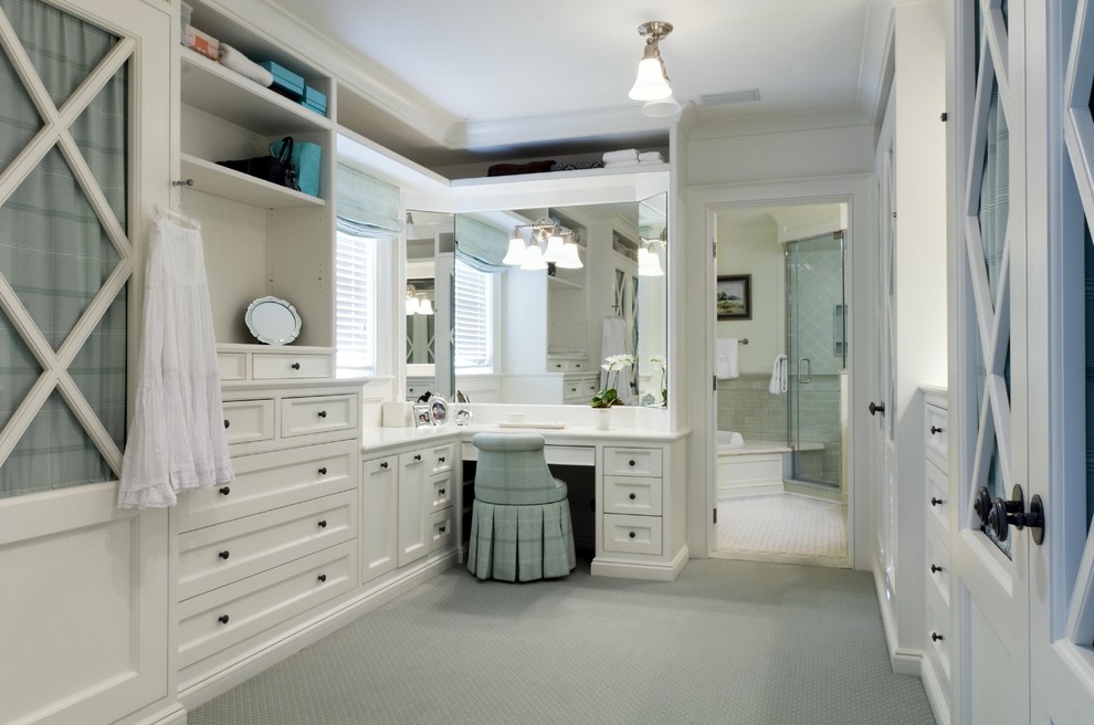 This is an example of a traditional dressing room in Newark with white cabinets.