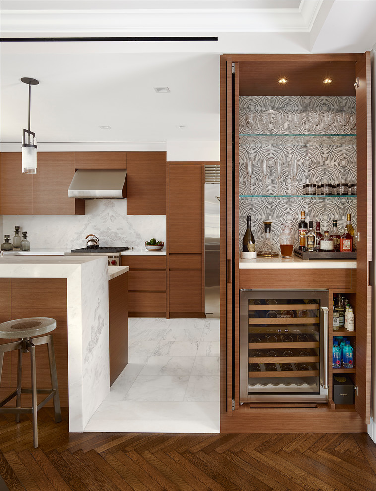 This is an example of a small contemporary single-wall home bar in New York with no sink, medium wood cabinets, multi-coloured splashback, medium hardwood floors, solid surface benchtops, brown floor and open cabinets.