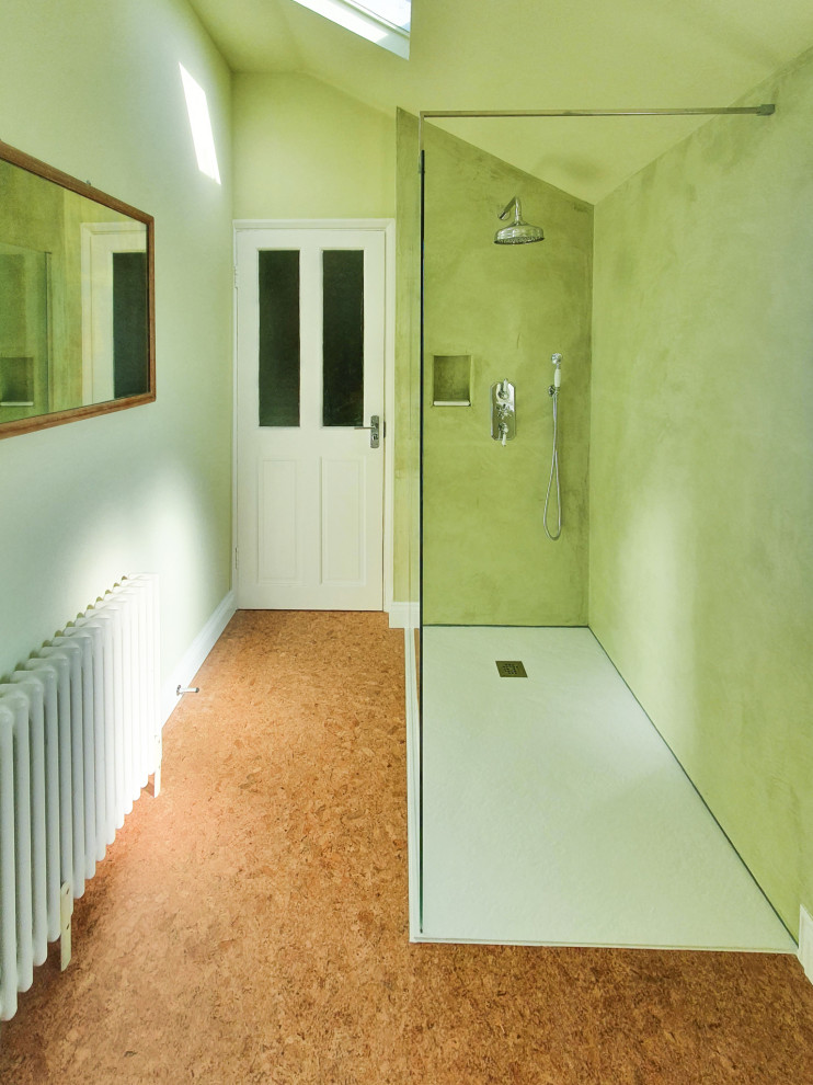 Photo of a modern bathroom in Sussex with an open shower, green walls, cork floors and an open shower.