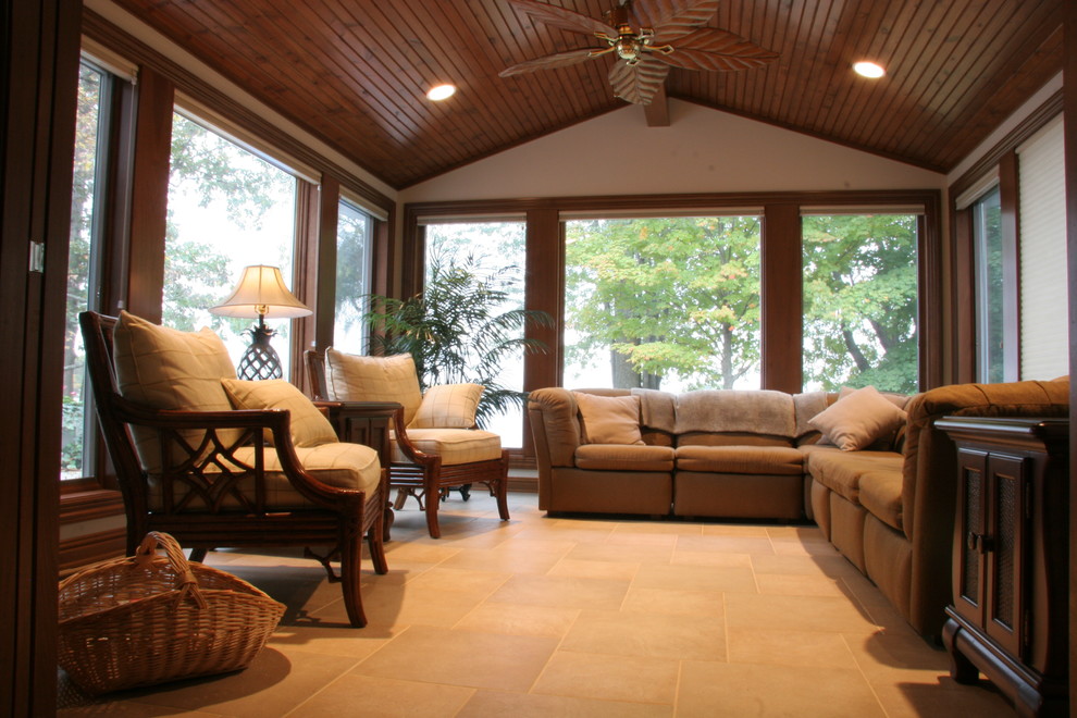 This is an example of a tropical sunroom in Indianapolis.