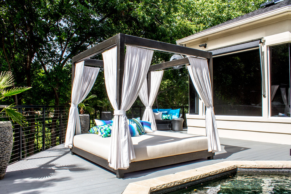 Inspiration for a large contemporary backyard patio in Dallas with decking and no cover.