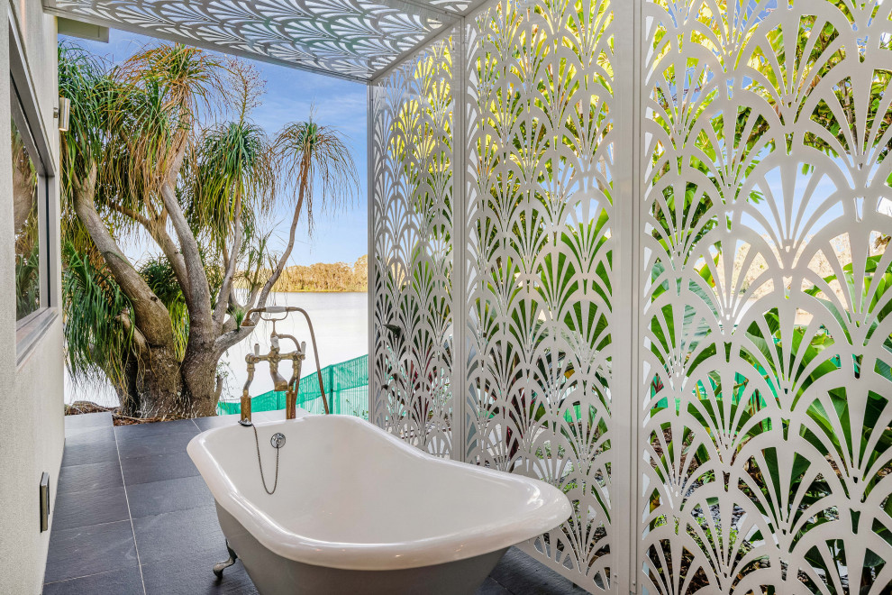 Contemporary patio in Gold Coast - Tweed with an outdoor shower, tile and a pergola.