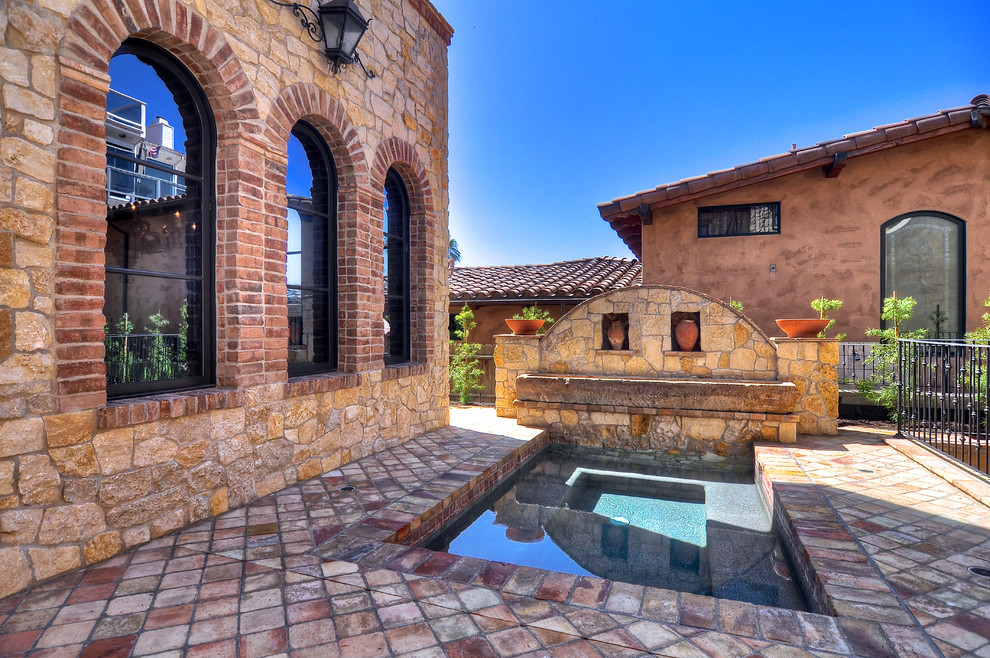 Inspiration for a mediterranean courtyard pool in Orange County.