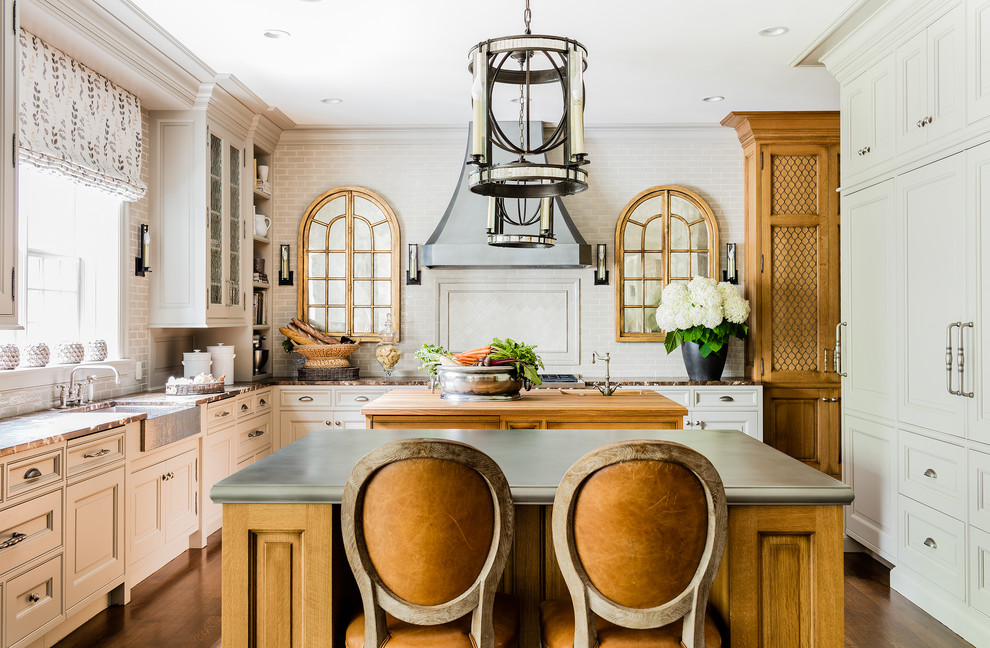Photo of a large traditional u-shaped kitchen in Boston with multiple islands.