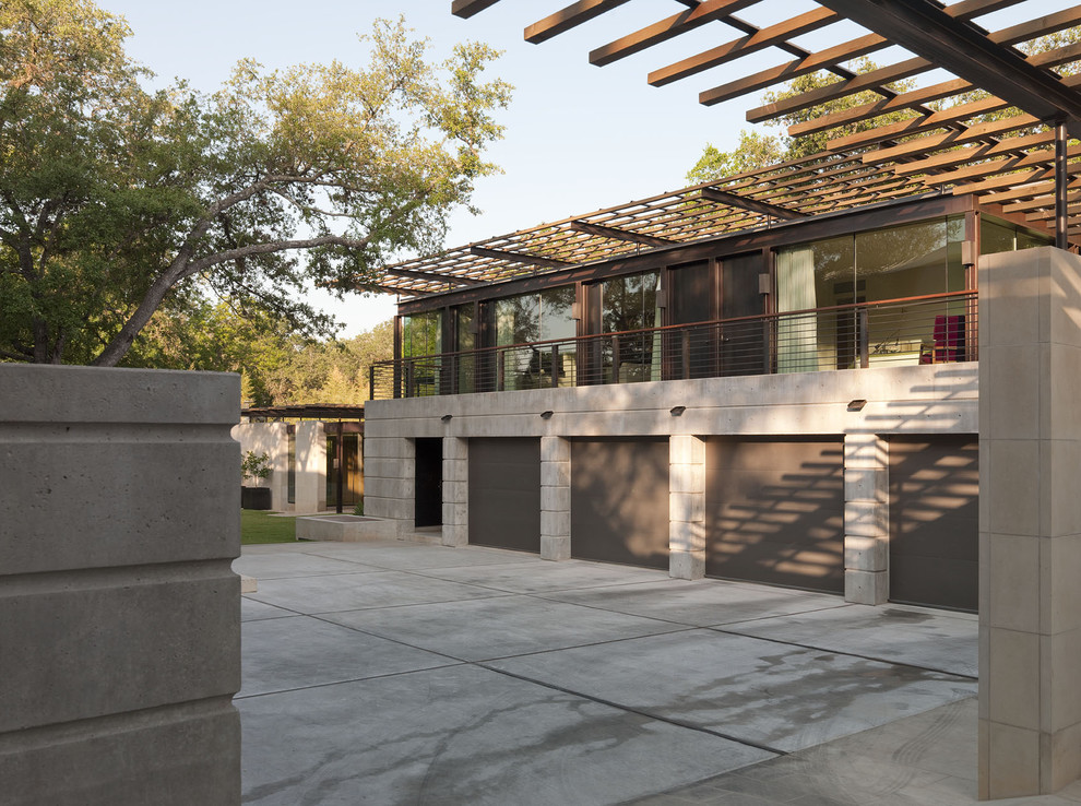Inspiration for a mid-sized contemporary attached four-car carport in Austin.