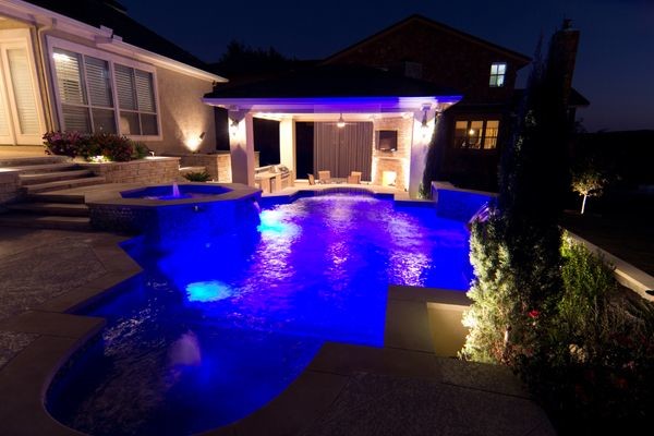 Inspiration for an eclectic backyard custom-shaped pool remodel in Austin