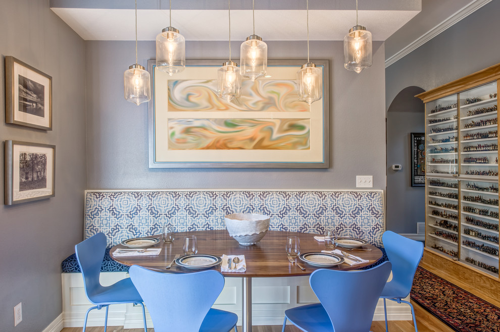 Large transitional u-shaped light wood floor kitchen/dining room combo photo in Denver with a farmhouse sink, recessed-panel cabinets, gray cabinets, quartzite countertops, blue backsplash, ceramic backsplash, stainless steel appliances and an island