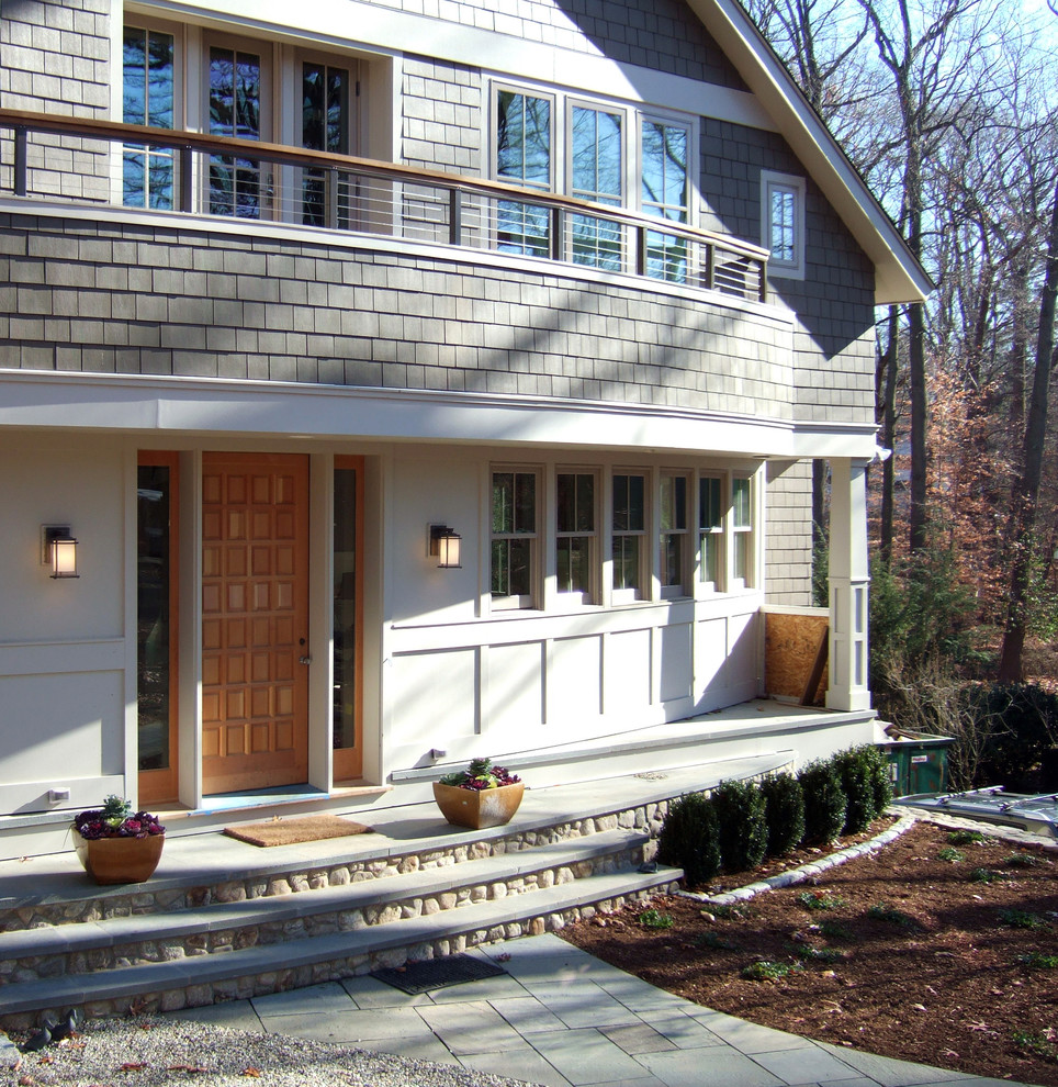 Photo of a mid-sized arts and crafts two-storey grey exterior in New York with mixed siding.