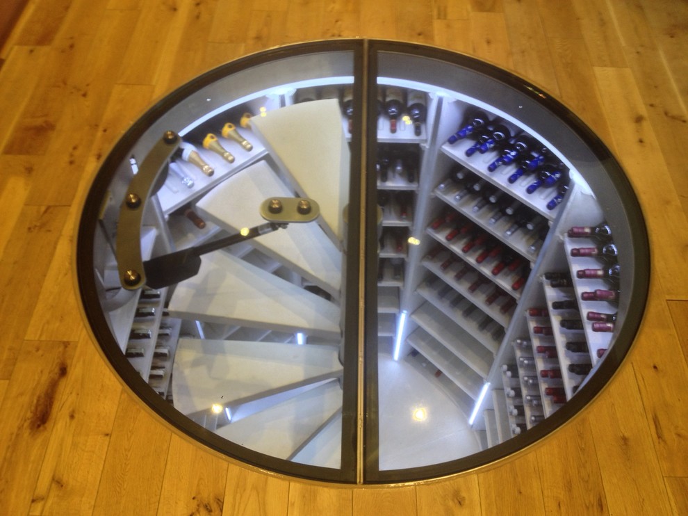 Inspiration for a contemporary wine cellar in Sussex.