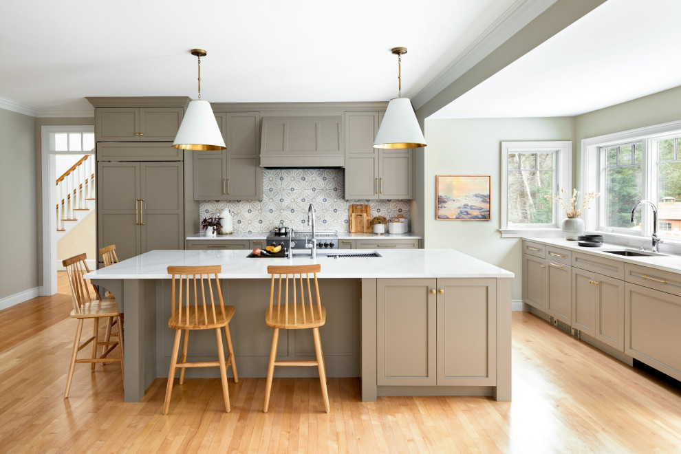 Inspiration for a transitional kitchen remodel in Providence with marble backsplash and an island