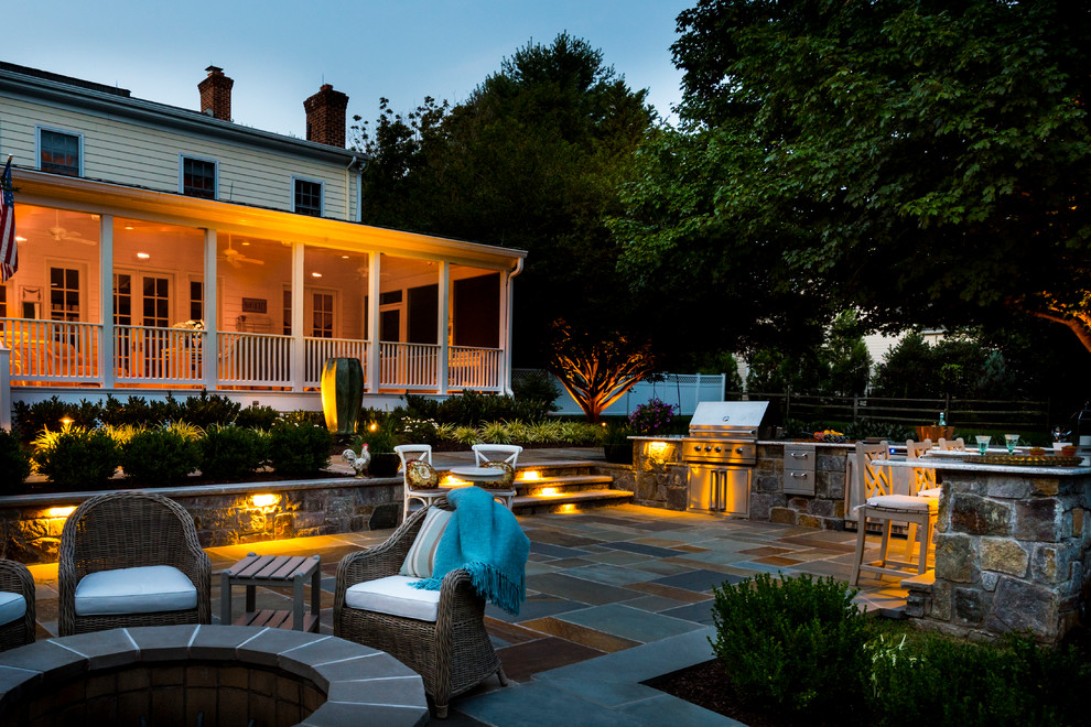 Traditional backyard patio in DC Metro with an outdoor kitchen, tile and no cover.