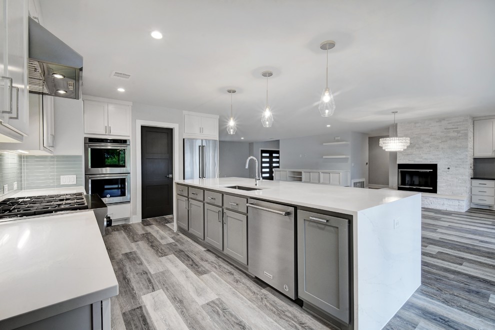 Design ideas for a large contemporary kitchen in Austin with vinyl floors and grey floor.