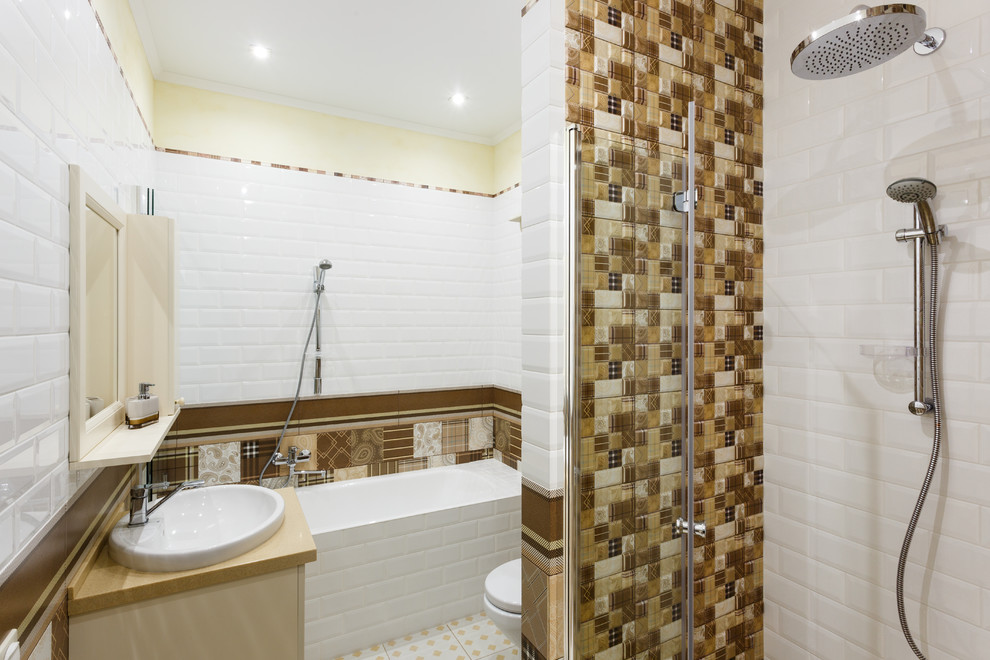 This is an example of a contemporary bathroom in Other with light wood cabinets, an alcove tub, an alcove shower, a wall-mount toilet, white tile, ceramic tile, white walls, ceramic floors and a pedestal sink.