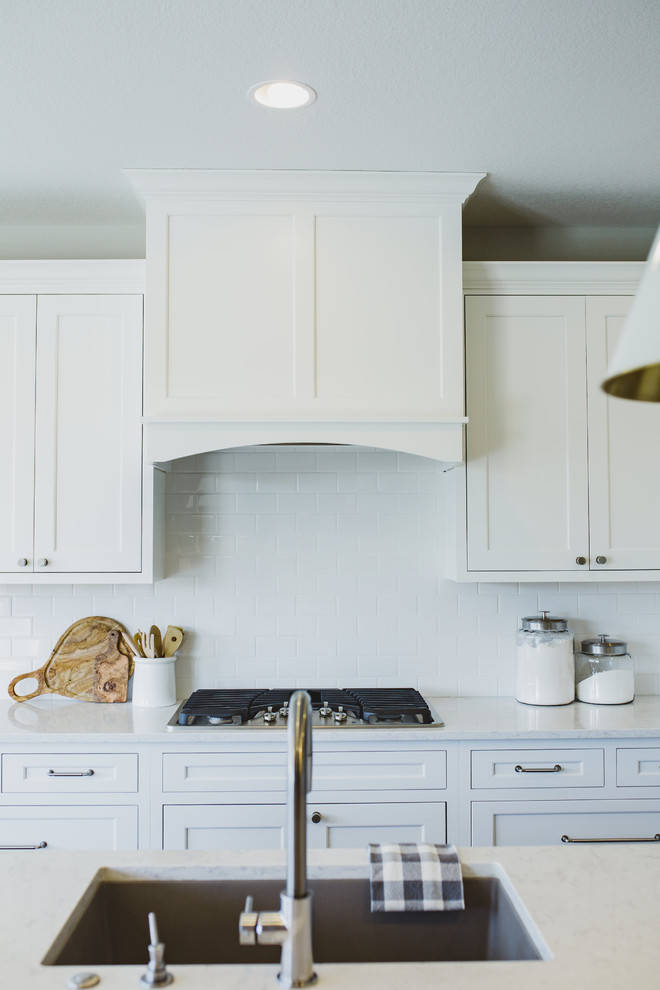Example of a transitional kitchen design in Denver