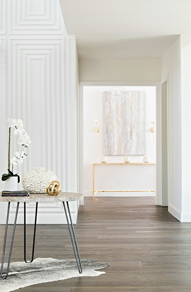 Inspiration for an expansive transitional hallway in Orlando with white walls and dark hardwood floors.