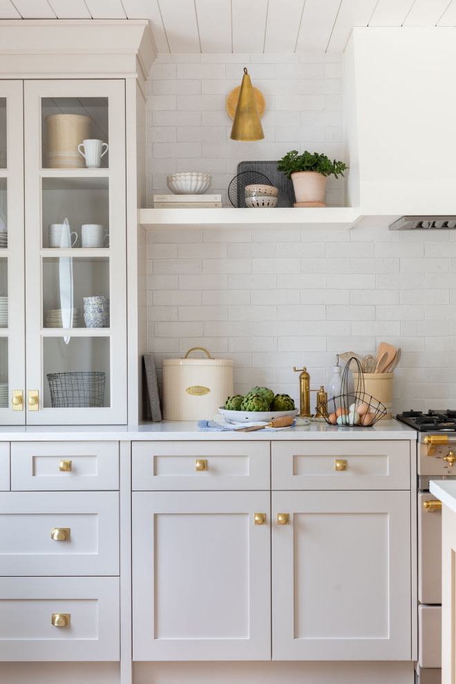 Inspiration for a mid-sized timeless kitchen remodel with brick backsplash