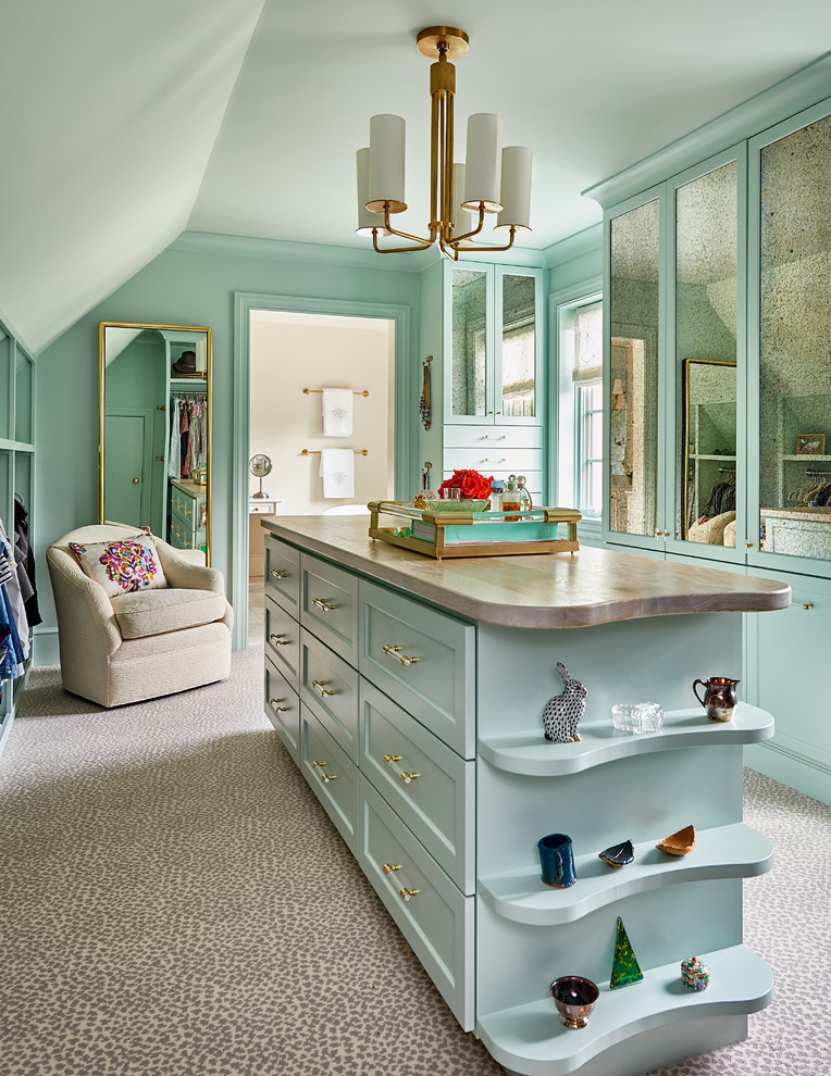 Inspiration for an expansive transitional gender-neutral dressing room in Other with carpet, shaker cabinets, blue cabinets and grey floor.