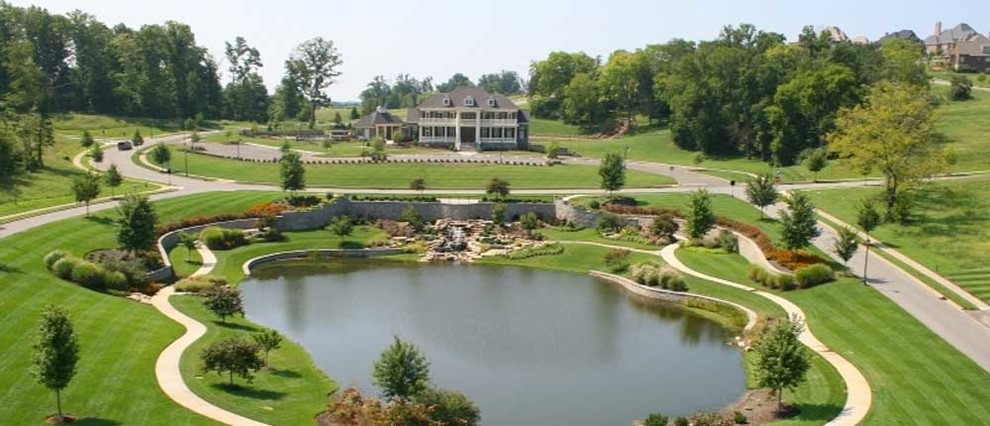 This is an example of a huge full sun front yard water fountain landscape.