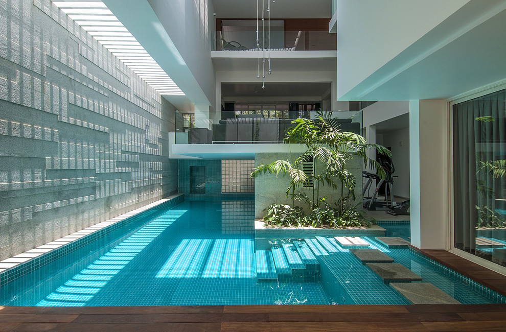 Photo of a large contemporary indoor custom-shaped pool in Bengaluru.