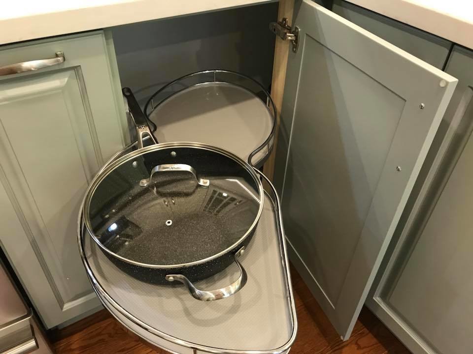 Example of a transitional u-shaped medium tone wood floor eat-in kitchen design in Toronto with an undermount sink, raised-panel cabinets, white cabinets, quartz countertops, white backsplash, porcelain backsplash, stainless steel appliances, no island and white countertops