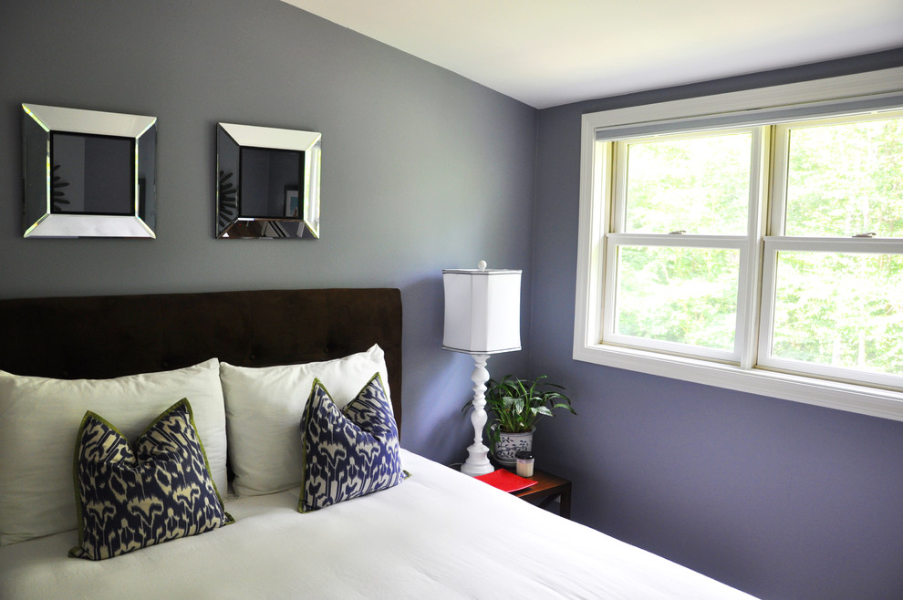 Photo of a small transitional guest bedroom in Burlington with blue walls and light hardwood floors.