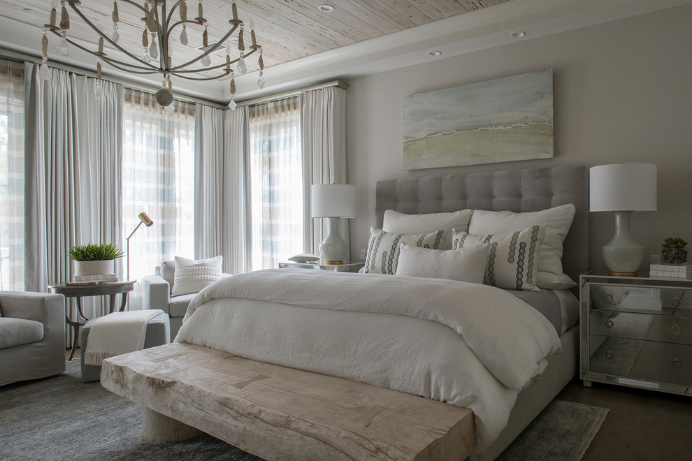 This is an example of a beach style bedroom in Miami with grey walls.