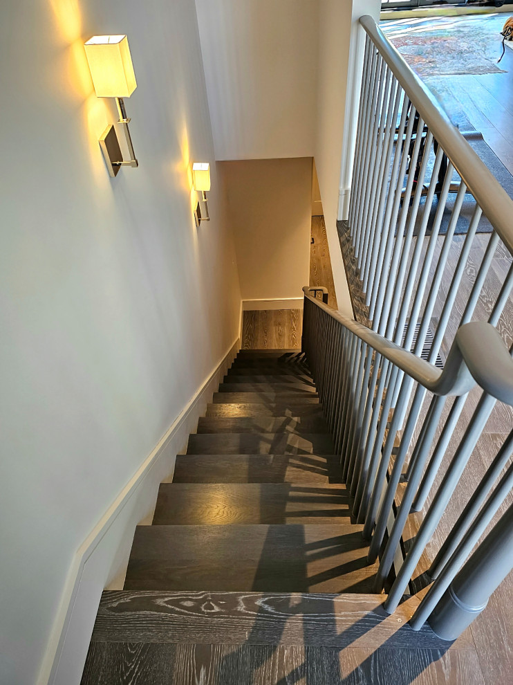 Staircase - huge transitional wooden straight wood railing staircase idea in DC Metro with painted risers