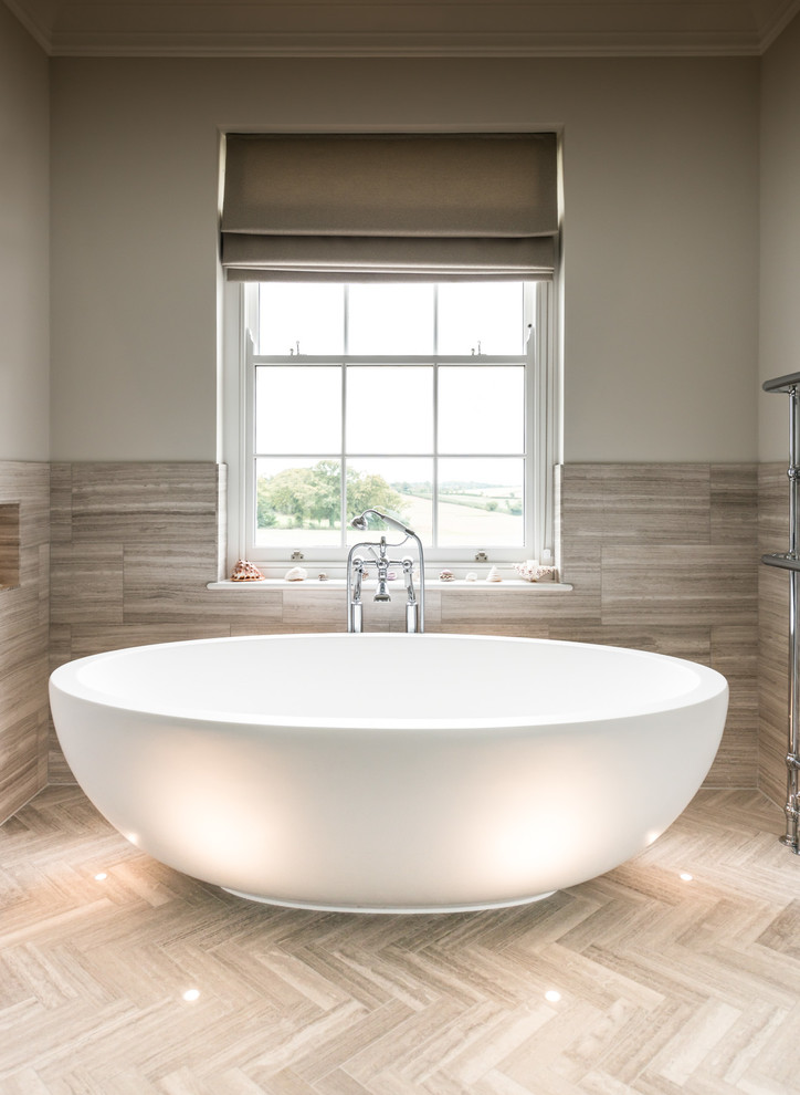 Photo of a large traditional master wet room bathroom in Devon with recessed-panel cabinets, a freestanding tub, a two-piece toilet, porcelain tile, porcelain floors, a pedestal sink and an open shower.