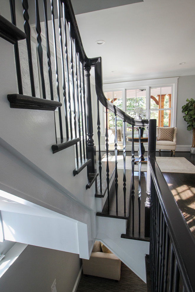 Inspiration for a large transitional wooden l-shaped mixed material railing staircase remodel in DC Metro with painted risers