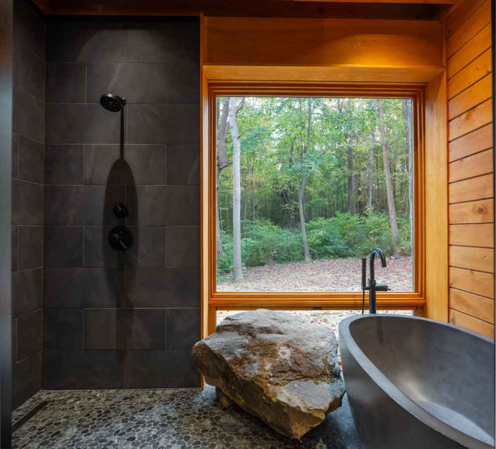 This is an example of a large country master wet room bathroom in Other with a freestanding tub, gray tile, slate, pebble tile floors, grey floor and an open shower.