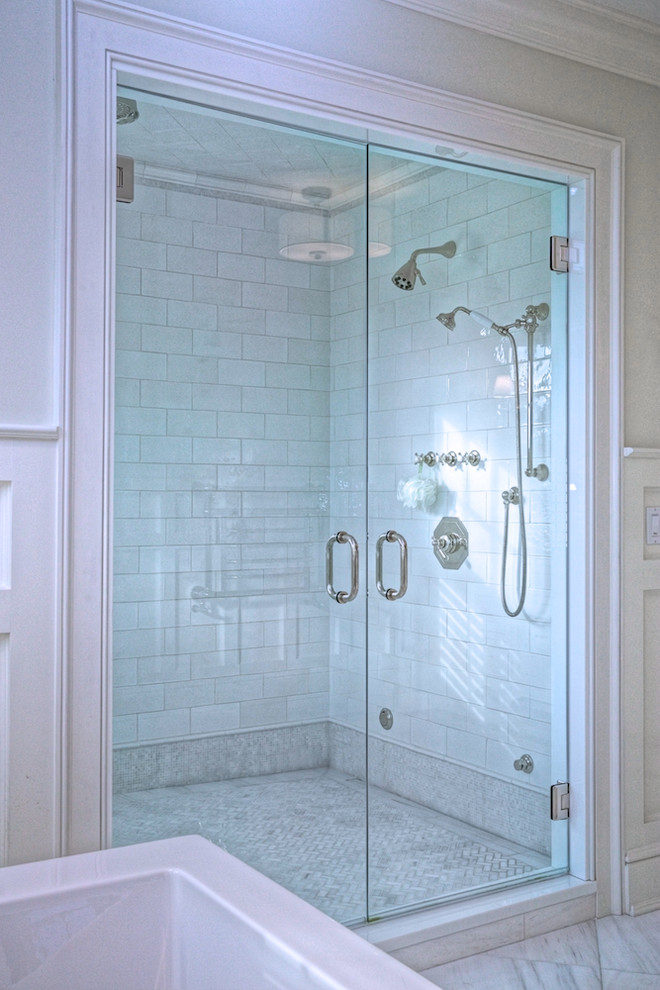 Freestanding bathtub - large traditional master marble floor and gray floor freestanding bathtub idea in New York with gray walls, a hinged shower door, recessed-panel cabinets, white cabinets, a two-piece toilet, an undermount sink and white countertops