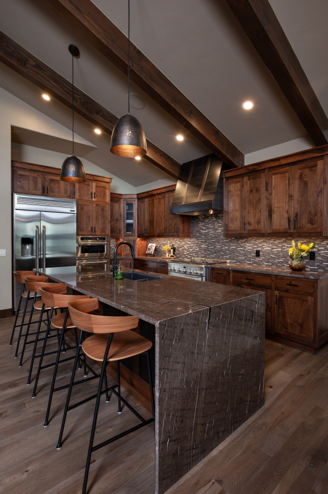 Country kitchen in Other with exposed beam.