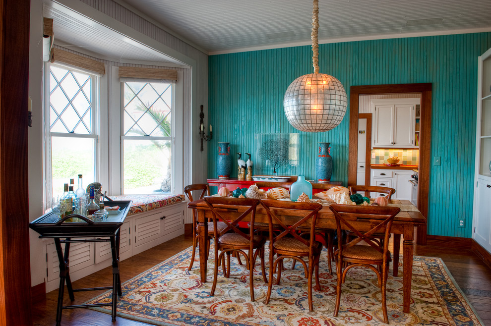 Inspiration for a mid-sized beach style kitchen/dining combo with blue walls and medium hardwood floors.