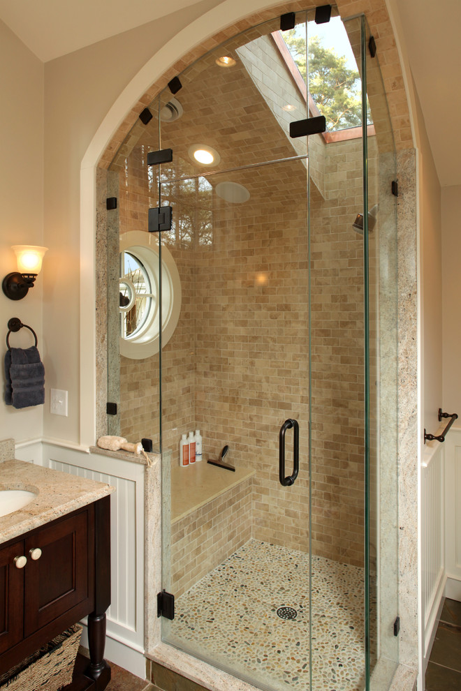 Photo of a traditional bathroom in Boston with a console sink, travertine and a shower seat.