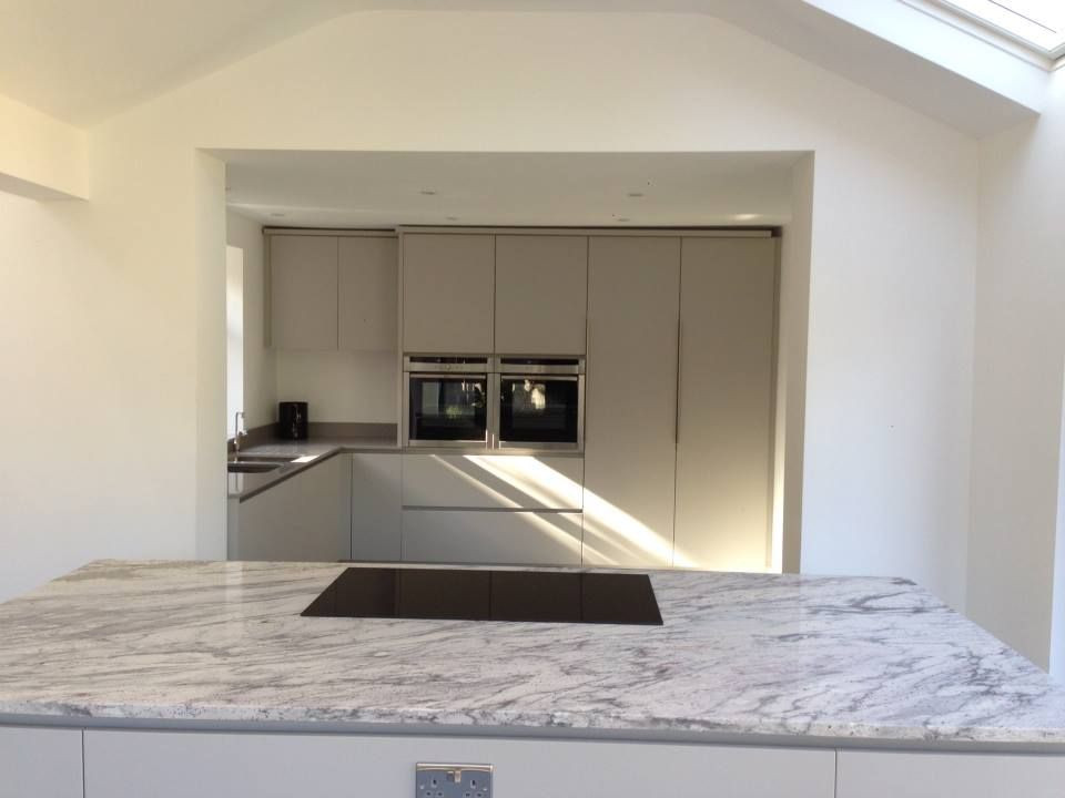 This is an example of a country kitchen in London with granite benchtops and white benchtop.