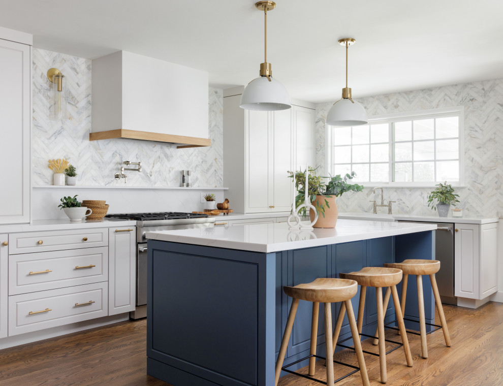Design ideas for a mid-sized contemporary single-wall eat-in kitchen in Orange County with a farmhouse sink, louvered cabinets, blue cabinets, quartzite benchtops, multi-coloured splashback, marble splashback, stainless steel appliances, light hardwood floors, with island, brown floor, white benchtop and coffered.